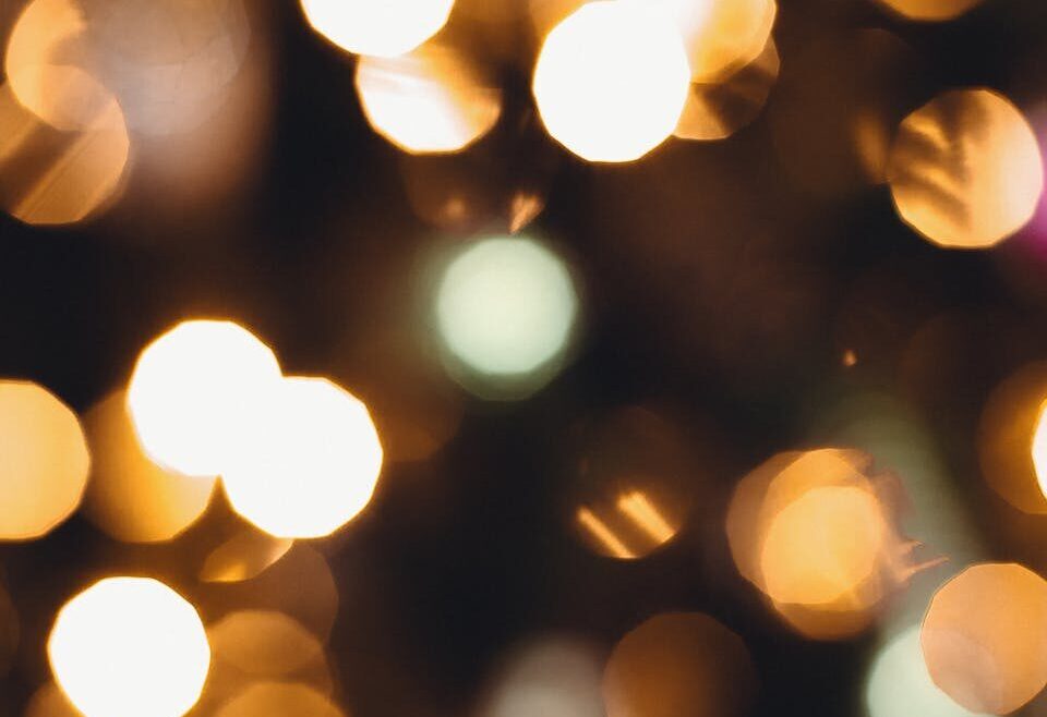 A captivating abstract image featuring bokeh lights with warm and soft tones ideal for backgrounds.